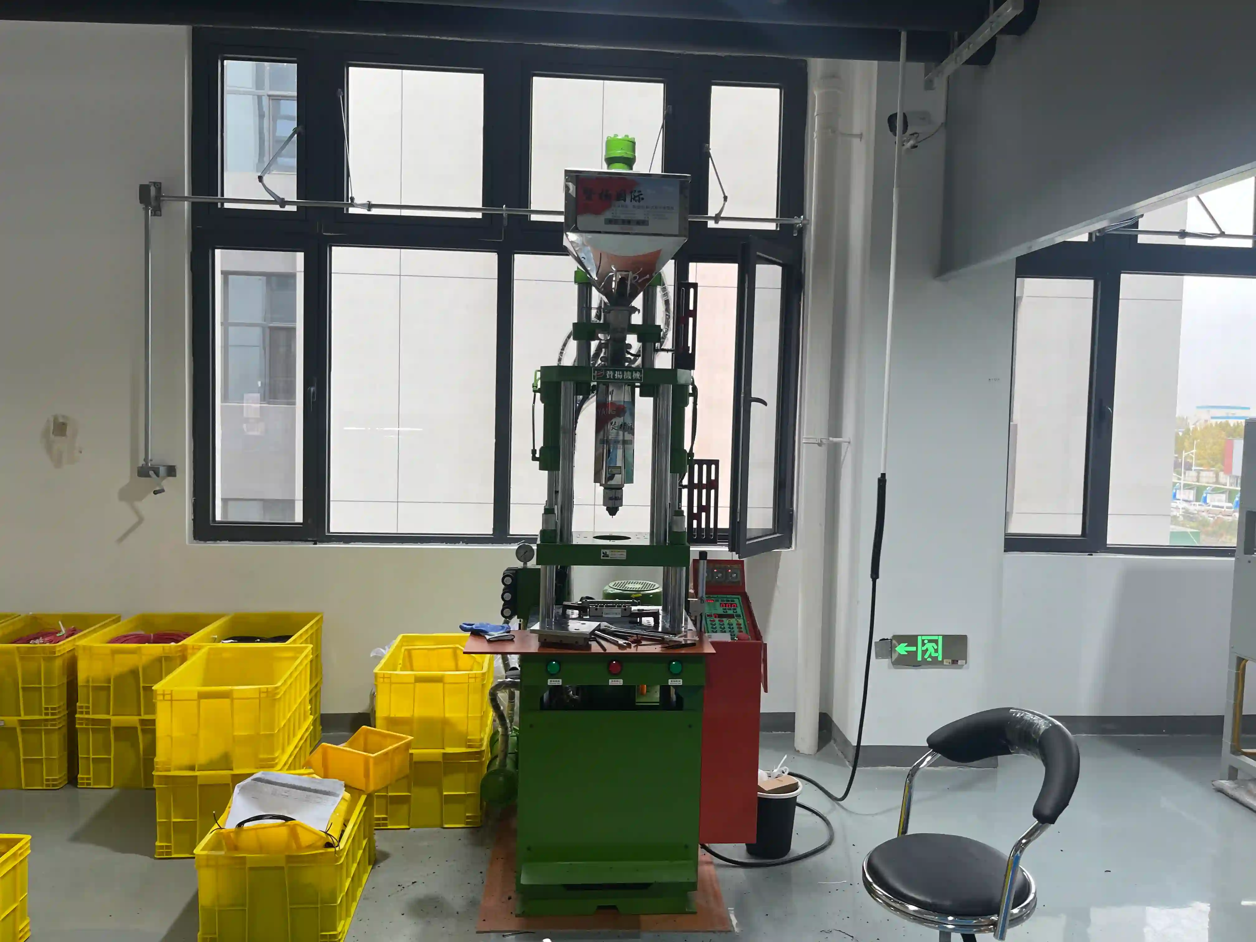 Injection overmolding machine for custom cable assembly manufacturing